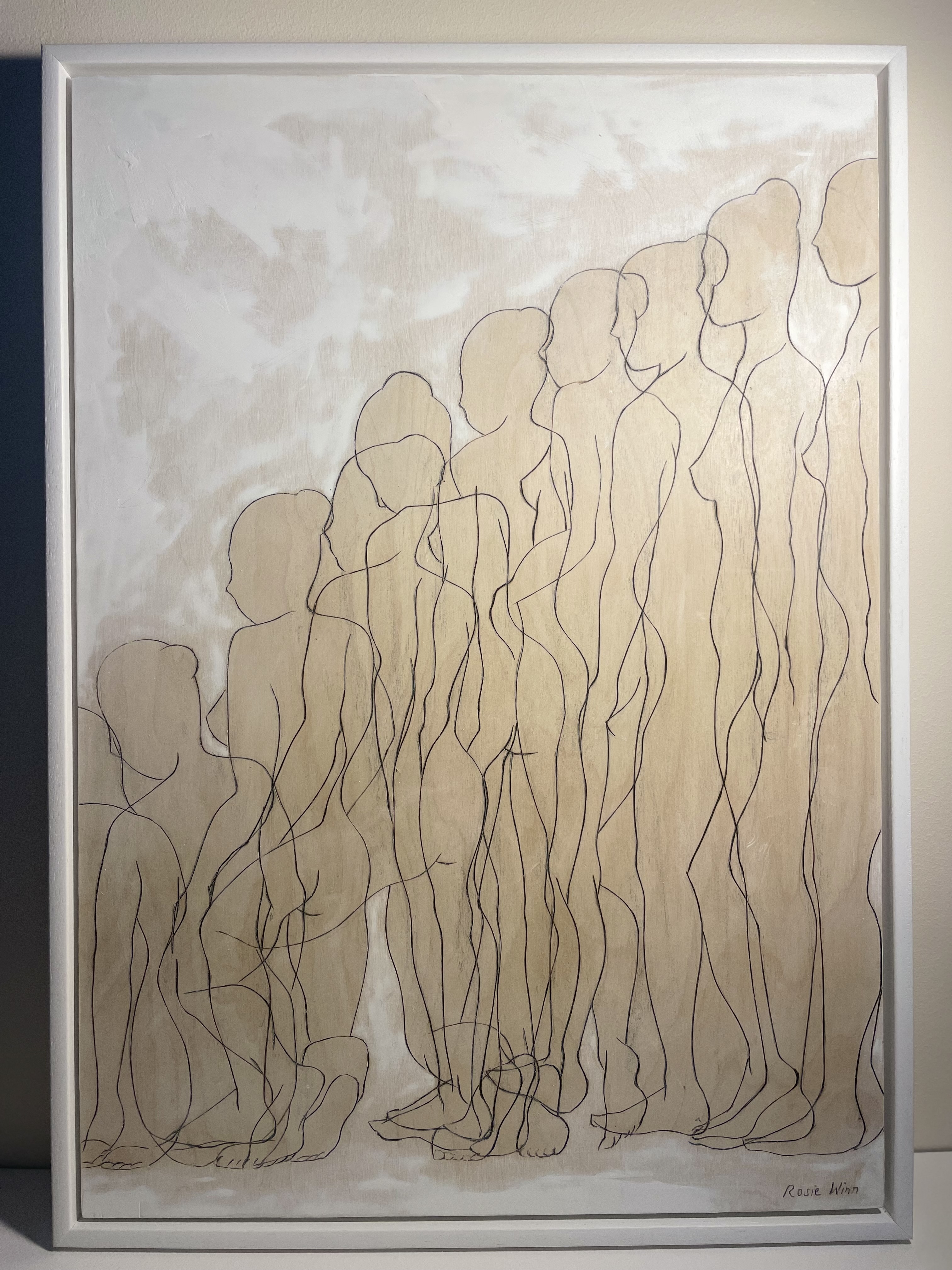 Line drawing on wood of overlapping female figures