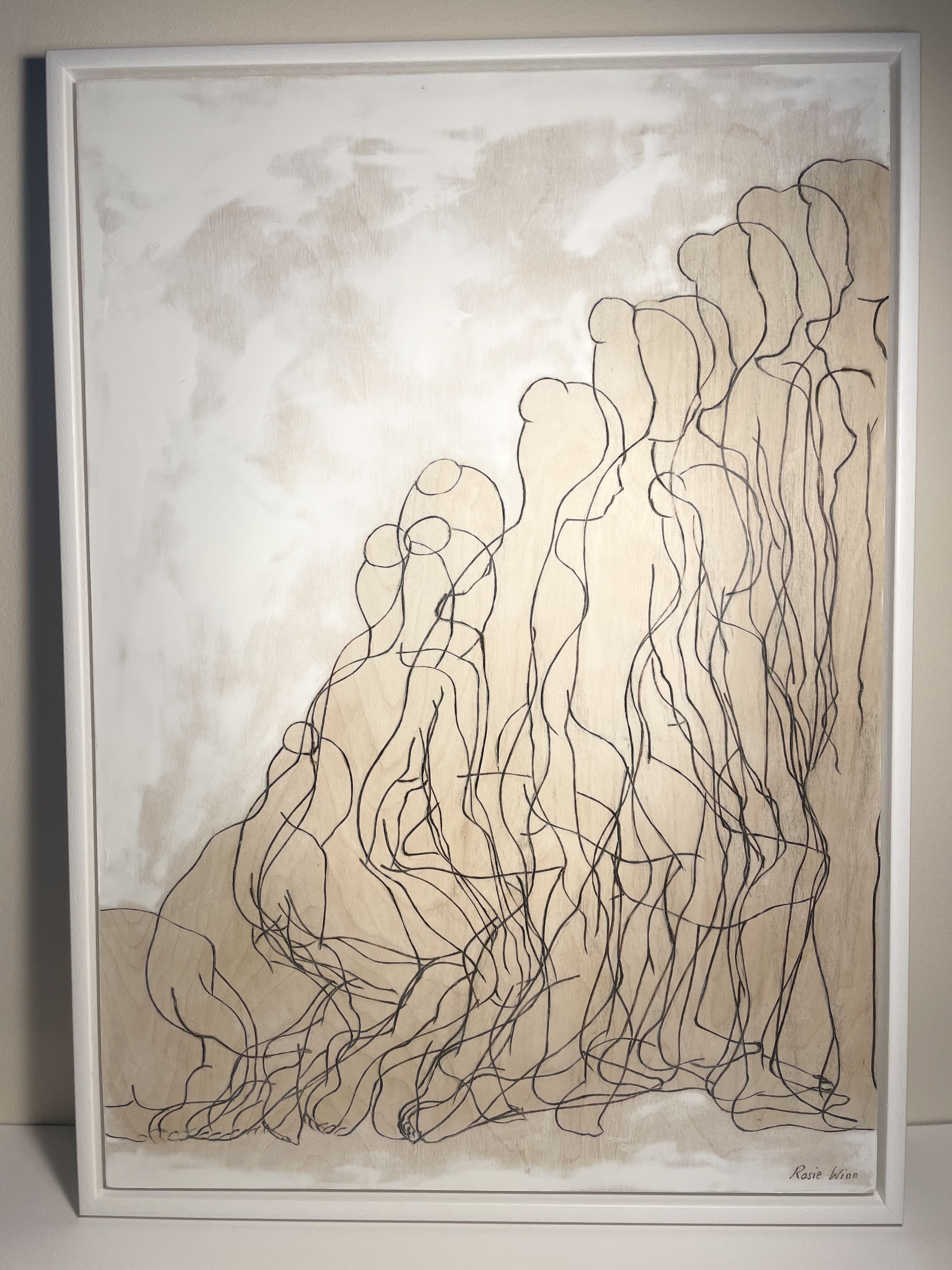 Line drawing on wood of overlapping female figures