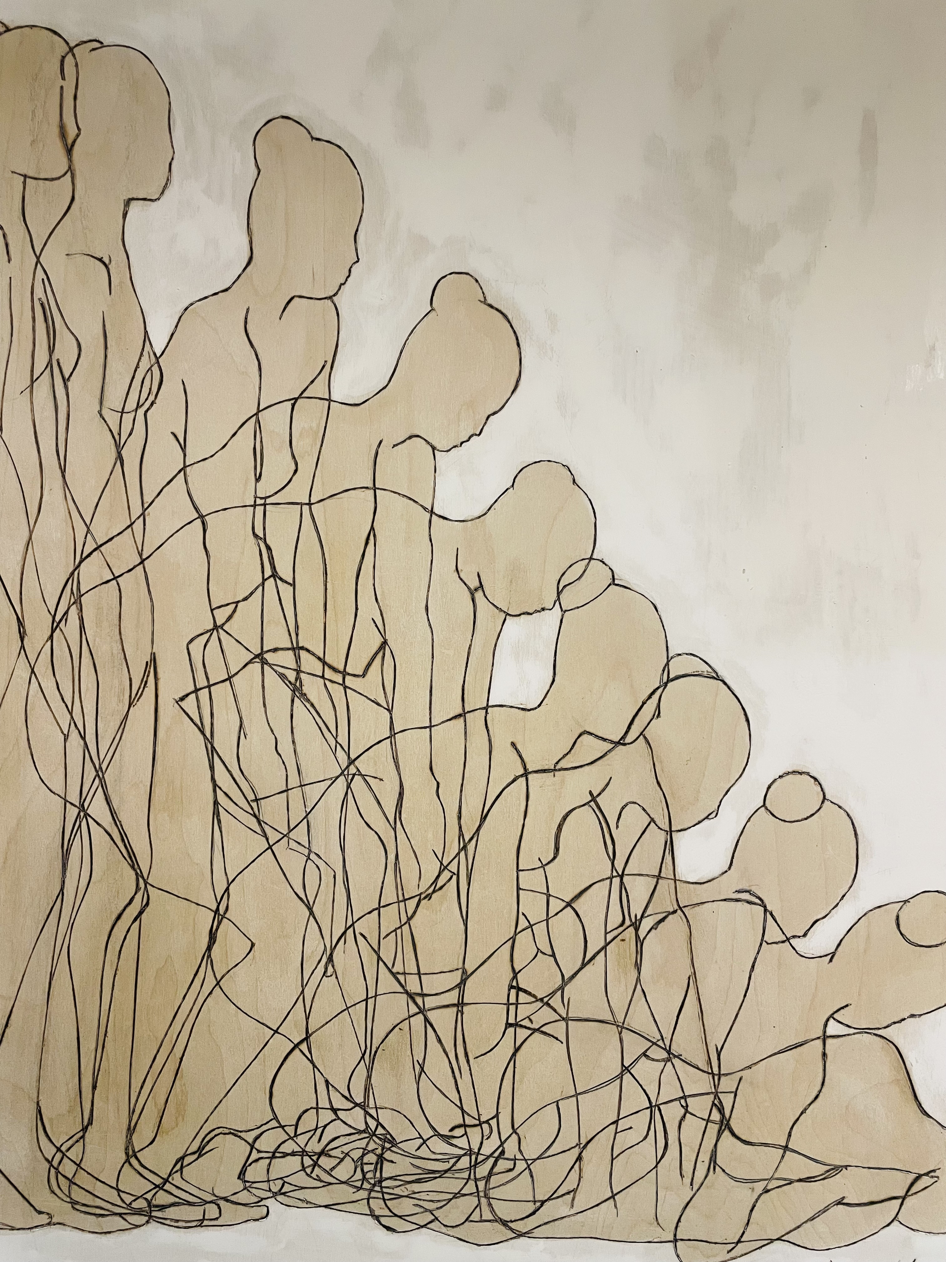 Line drawing on wood of overlapping female figures